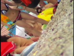 Hidden cam on a nudist beach shows men and women