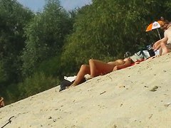 Beach video of perfect boobs being rubbed with tanning oil