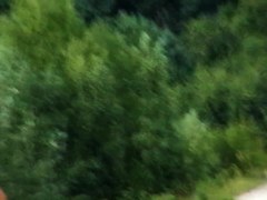 Nude blonde wearing a baseball cap displays her tits on the beach