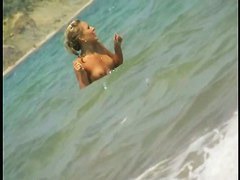 Nice babes are being filmed on camera on the beach