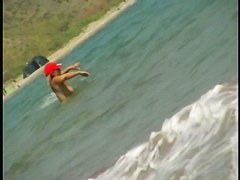 Nice babes are being filmed on camera on the beach