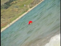 Nice babes are being filmed on camera on the beach