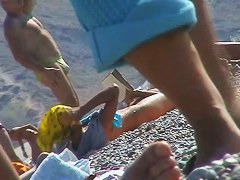 Hot red hair babe takes a nude sunbath at the beach