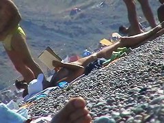 Hot red hair babe takes a nude sunbath at the beach