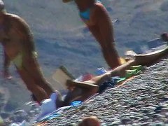 Hot red hair babe takes a nude sunbath at the beach