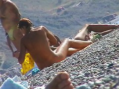 Hot red hair babe takes a nude sunbath at the beach