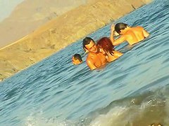 Ladies on the nudist beach exposed to the hidden cam