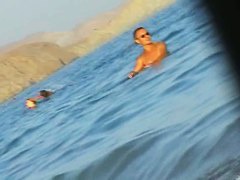 Ladies on the nudist beach exposed to the hidden cam