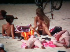2 white babes with nice big side saggin breasts on a nude beach