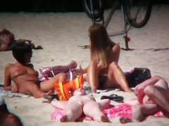 2 white babes with nice big side saggin breasts on a nude beach