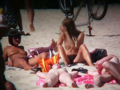 2 white babes with nice big side saggin breasts on a nude beach