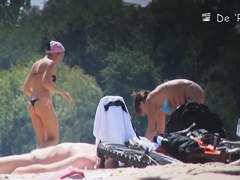 Girl with big belly sunbathing topless on beach voyeur cam