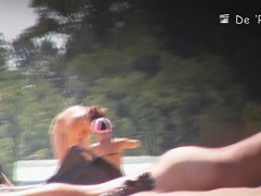 Girl with big belly sunbathing topless on beach voyeur cam