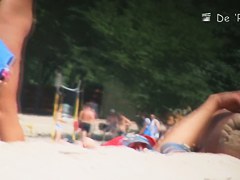 The beach is full of topless and bottomless girls