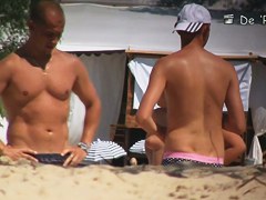 The beach is full of topless and bottomless girls