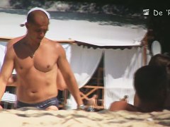 The beach is full of topless and bottomless girls