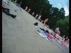 A voracious voyeur loves making videos on the nude beach.