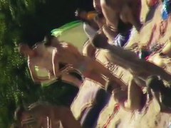 Hot brunette bares it all to the nudist beach voyeur