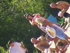 Hot brunette bares it all to the nudist beach voyeur