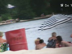 Blonde mature chick is naked at the beach