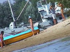 Beautiful chicks playing at the beach while I film the