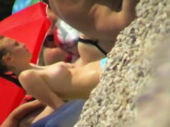 Spy beach cams film hot nudist girls playing in the water