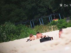 wide open and bending over on the beach with the nudists