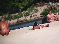 wide open and bending over on the beach with the nudists