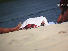 wide open and bending over on the beach with the nudists