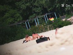 wide open and bending over on the beach with the nudists