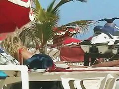 Awesome girls posing in bikinis on the beach