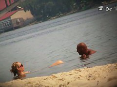 Hidden beach camera video of attractive nudist men and women