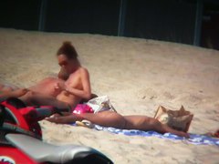 Sexy blonde and naughty brunette on nude beach
