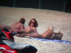 Sexy blonde and naughty brunette on nude beach