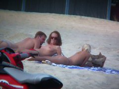 Sexy blonde and naughty brunette on nude beach