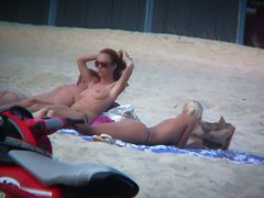 Sexy blonde and naughty brunette on nude beach