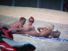 Sexy blonde and naughty brunette on nude beach