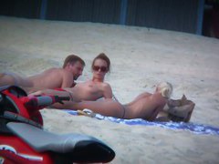 Sexy blonde and naughty brunette on nude beach