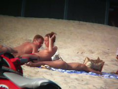 Sexy blonde and naughty brunette on nude beach