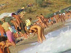 Sexy beach nudist girl spied talking on phone near water