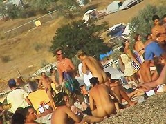 Sexy beach nudist girl spied talking on phone near water