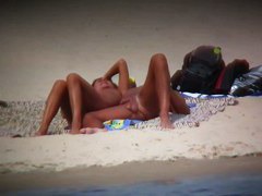 Hot wife flaunts her bushy muff on a nudist beach