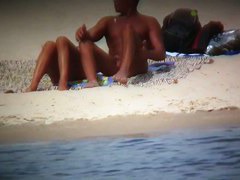 Hot wife flaunts her bushy muff on a nudist beach