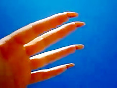 Long nails and sand on the beach