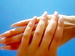 Long nails and sand on the beach
