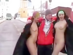 Two girls flashing in the snow