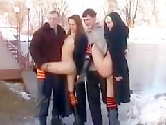 Two girls flashing in the snow