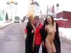 Two girls flashing in the snow