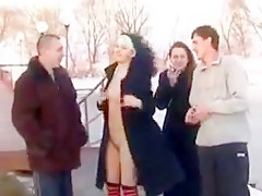 Two girls flashing in the snow