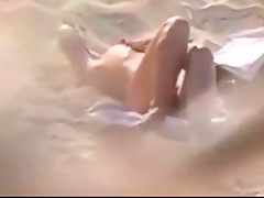 Nude beach - hot brunette plays for voyeur